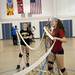 Rudolf Steiner sophomore Kaiya Herman Hilker and freshman Brooke Shuler fold the volleyball net on Monday. Daniel Brenner I AnnArbor.com